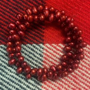 White House Black Market adjustable beaded bracelet. Dark red on oval beads. OS